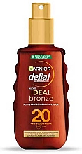 Düfte, Parfümerie und Kosmetik Bräunungsspray - Garnier Delial Ambre Solaire Ideal Bronze Protective Oil Spray SPF20