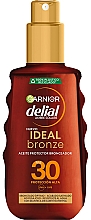 Düfte, Parfümerie und Kosmetik Sonnenschutzöl-Spray - Garnier Delial Ambre Solaire Ideal Bronze Protective Oil Spray SPF30