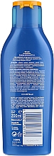 Feuchtigkeitsspendende Sonnenmilch LSF 15 - Nivea Sun Protect & Moisture Sun Lotion SPF15 — Bild N4