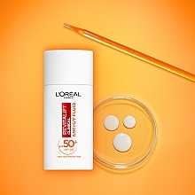 Leuchtende Tagescreme mit SPF 50+ - L'Oreal Paris Revitalift Clinical — Bild N11