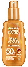 Sonnenschutzlotion - Garnier Ambre Solaire Ideal Bronze Milk-In-Spray SPF50  — Bild N1