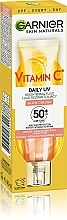 Tages-Sonnenschutzfluid mit Vitamin C für einen strahlenden Teint SPF50+ - Garnier Skin Naturals — Bild N4