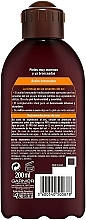 Intensives Bräunungsöl mit Kokosnussduft - Garnier Delial Ambre Solaire Intense Suntan Coco Oil — Bild N2