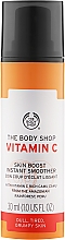 Düfte, Parfümerie und Kosmetik Glättendes und erfrischendes Gesichtsserum mit Vitamin C aus Camu-Beeren und lichtreflektierenden Partikeln - The Body Shop Vitamin C Skin Boost Instant Smoother