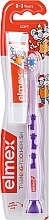 Kinderzahnbürste 0-3 Jahre weich lila mit Gi­raf­fen - Elmex Learn Toothbrush Soft + Toothpaste 12ml — Bild N1