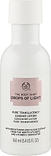 Düfte, Parfümerie und Kosmetik Aufhellende Gesichtsessenz mit roten Algen - The Body Shop Drops of Light Pure Translucency Essence Lotion