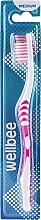 Düfte, Parfümerie und Kosmetik Mittelharte Zahnbürste in Blisterverpackung rosa - Wellbee